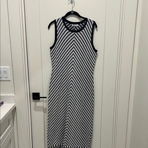 Navy and white knit dress with fringe on the bottom